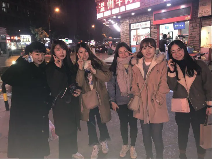 Students out together on a night street